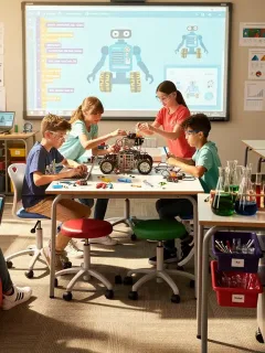 Students engaged in hands-on STEM learning activities in a modern classroom.