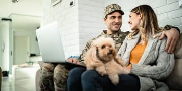 Happy military couple communicating while using laptop at home.
